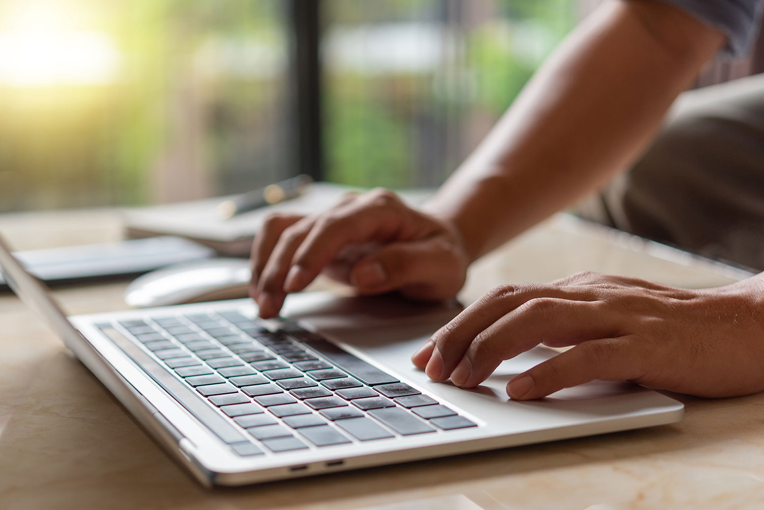 What to Write on Your Website to Attract More Customers - typing on laptop