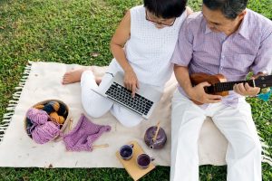 Why Your Website Should Feel Like a Conversation, Not a Sales Pitch - on laptop couple relaxing