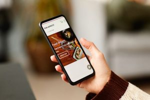 Person on smartphone converting