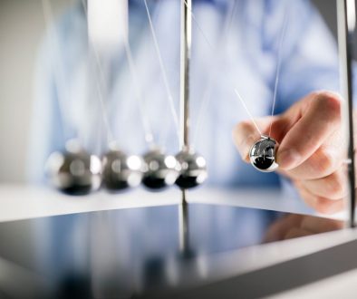 Is Your Website Creating the Connection That Makes People Take Action? Newtons cradle - business man