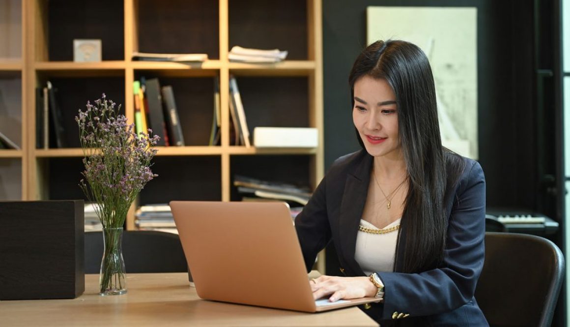 Professional Asian Woman on Laptop