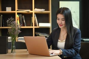 Professional Asian Woman on Laptop