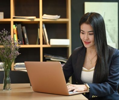 Professional Asian Woman on Laptop