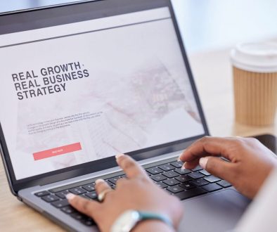 How Websites Should Evolve as Your Business Grows - professional on laptop on website with coffee