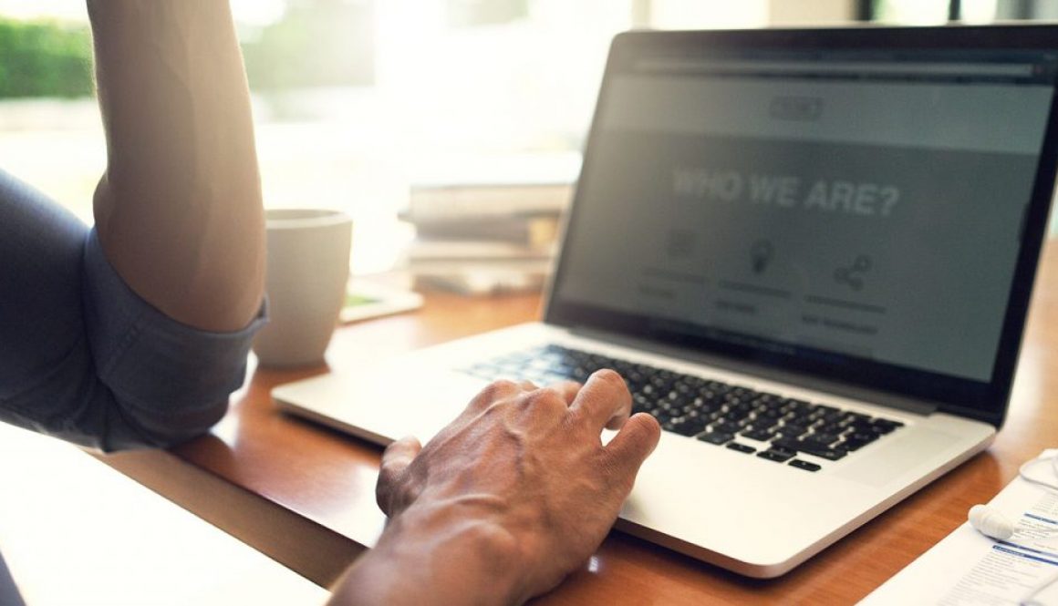 man on laptop, website homepage