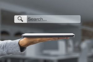 hand holding ipad internet browser search bar