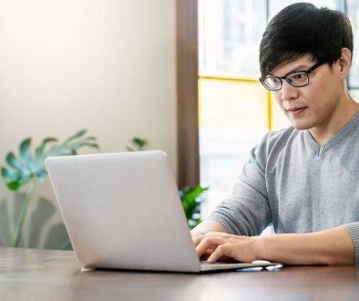Man at laptop typing