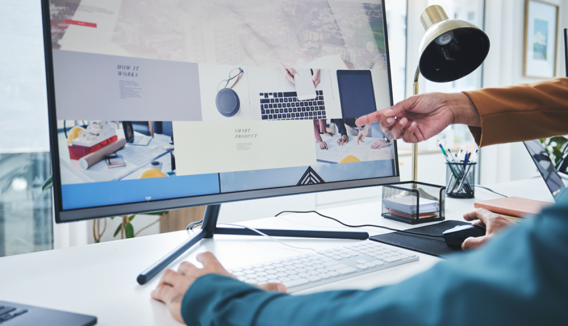 computer monitor with website hand pointing at the screen