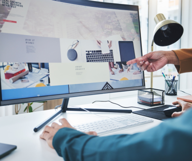 computer monitor with website hand pointing at the screen