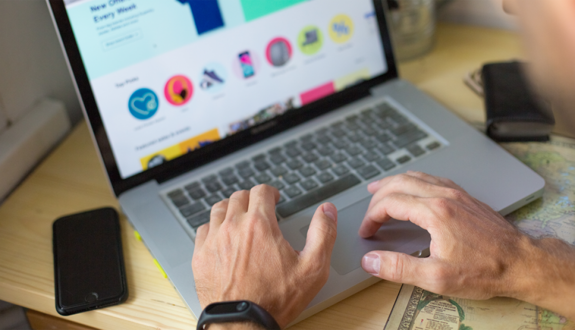 Man typing on laptop on website