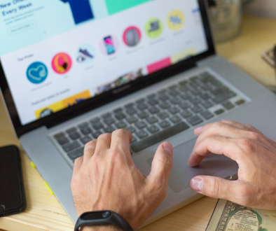 Man typing on laptop on website