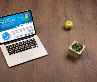 Laptop computer on wood background