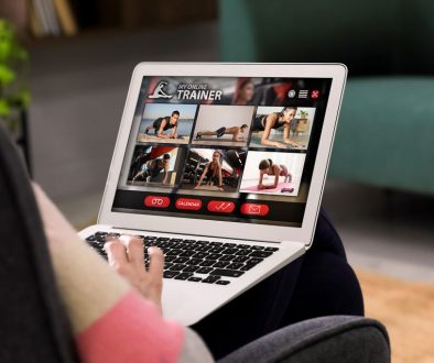Laptop with woman looking at images